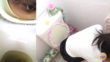 Asian female with loose stools in the bathroom